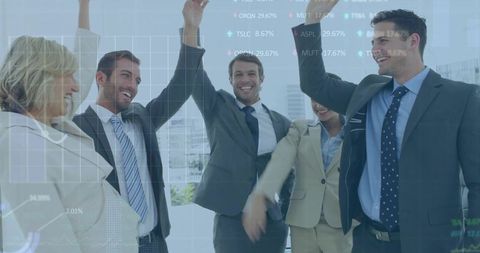 Business team celebrating success in modern office with financial charts overlay