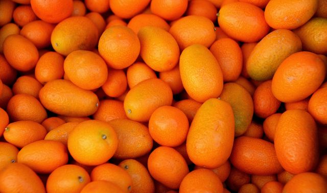 Fresh Kumquats Full Frame - Download Free Stock Photos Pikwizard.com