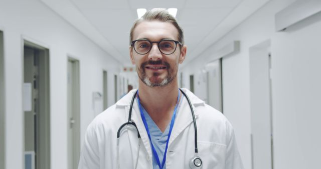 Confident Male Doctor Walking Hospital Corridor - Download Free Stock Images Pikwizard.com