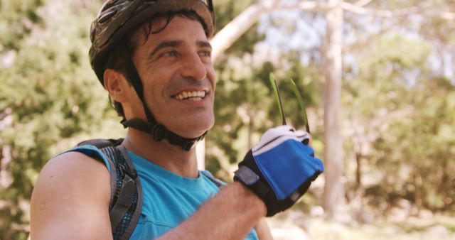 Smiling Man with Helmet and Gloves Enjoying Outdoor Cycling - Download Free Stock Images Pikwizard.com