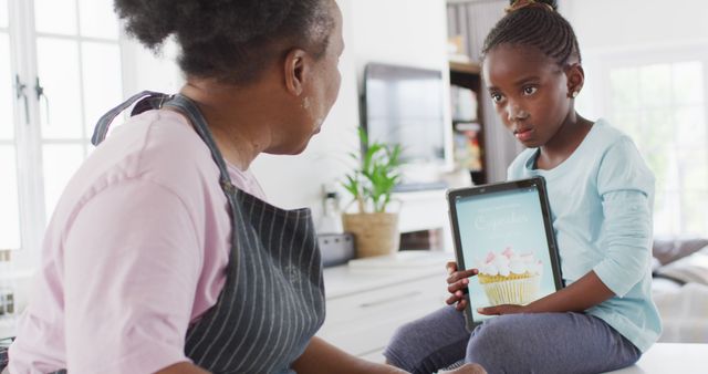 Grandmother and Granddaughter Baking Cupcakes Together - Download Free Stock Images Pikwizard.com