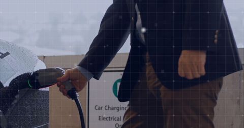 Businessman Charging Electric Car at Charging Station - Download Free Stock Images Pikwizard.com