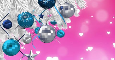 Colorful Baubles on Christmas Tree with Pink Heart Background