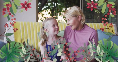 Joyful Mother and Daughter Embracing Surrounded by Vibrant Flowers
