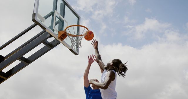 Outdoor Basketball Game, Players in Action Midday - Download Free Stock Images Pikwizard.com