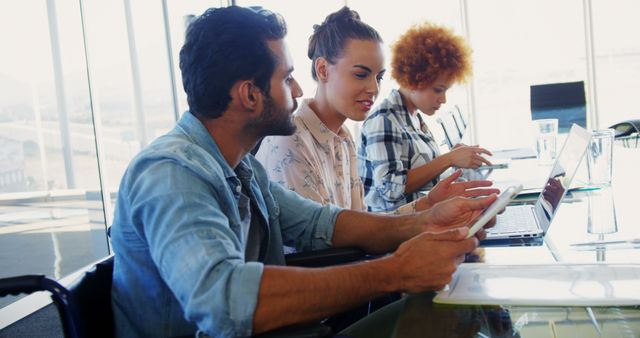 Multiracial Team Collaborating on Tablets and Laptops in Modern Office - Download Free Stock Images Pikwizard.com