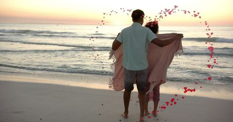 Romantic Beach Dance at Sunset with Heart Overlay