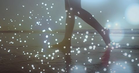 Enchanted evening beach walk with bokeh lights