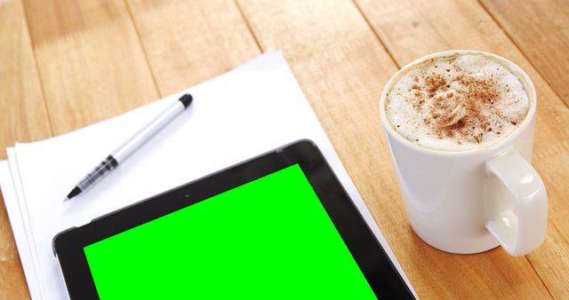 Tablet with Green Screen Next to Coffee Mug and Papers on Wooden Table - Download Free Stock Images Pikwizard.com