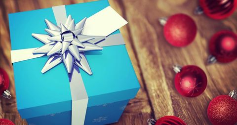 Gift Box with Silver Bow Amidst Decorations on Wooden Table - Download Free Stock Images Pikwizard.com
