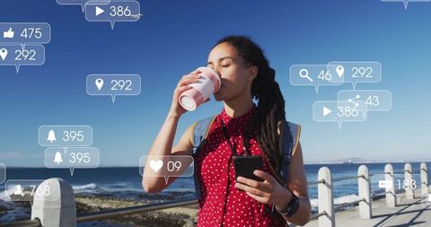 Woman Enjoying Coffee Near Ocean Vibrant with Social Media Notifications