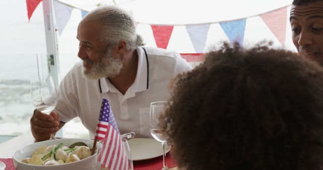 Multi-Generational Family Celebrating Fourth of July with Festive Meal - Download Free Stock Images Pikwizard.com