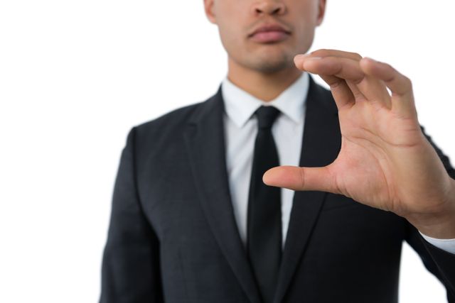Businessman Gesturing with Hand in Suit - Download Free Stock Photos Pikwizard.com