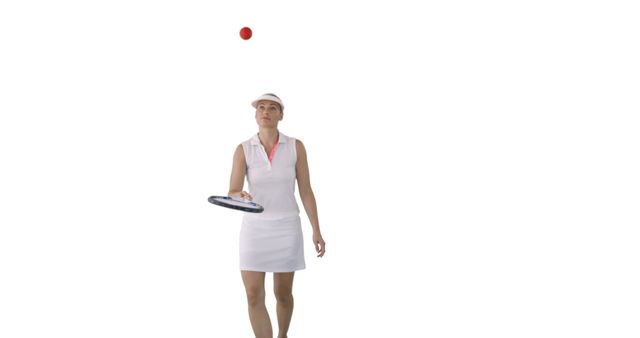 Female tennis player is balancing a ball on her racket in her sports attire against a white background. This can be used in promotions for tennis training, sports ads, or wellness campaigns focusing on concentration and precision.