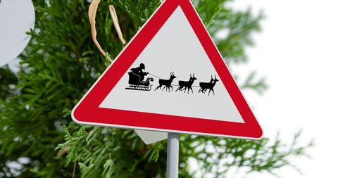 Festive road sign with santa and reindeer silhouette