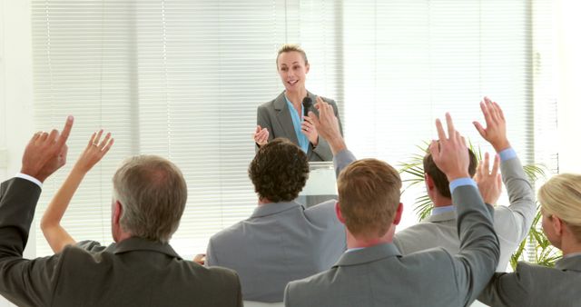 Businesswoman Engaging Team During Office Presentation - Download Free Stock Images Pikwizard.com