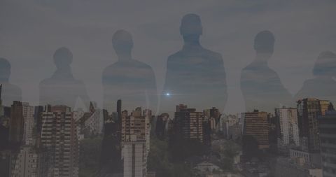 Silhouetted Figures Overlooking Modern City
