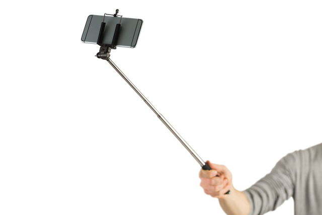 Casual Man Using Selfie Stick with Smartphone Isolated on Transparent Background - Download Free Stock Videos Pikwizard.com