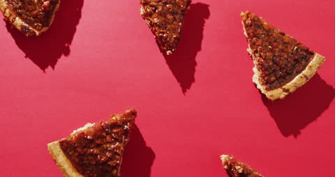 Overhead View of Pecan Pie Slices on Red Background