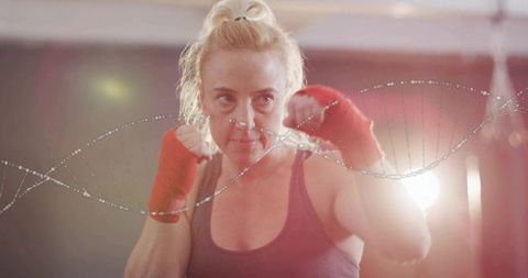 Female Boxer Training with DNA Helix Overlay in Gym Environment