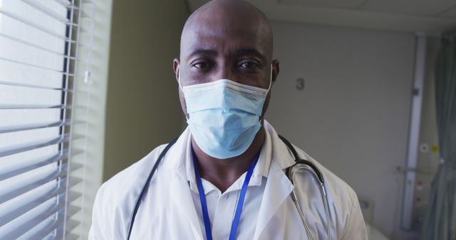 Confident Healthcare Professional Wearing Mask and Stethoscope in Hospital - Download Free Stock Images Pikwizard.com