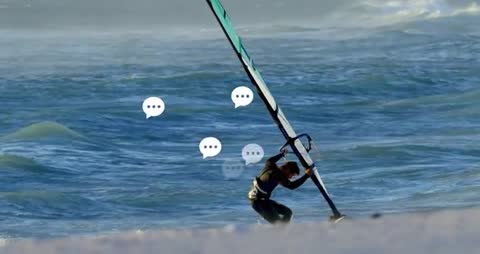 Windsurfer Checking Weather via Tech Icons on Ocean Beach