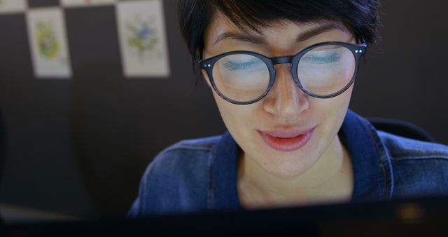 Focused Woman with Glasses Working on Computer in Office - Download Free Stock Images Pikwizard.com