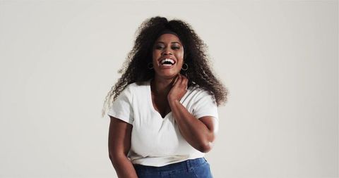 Confident african american woman laughing in casual attire