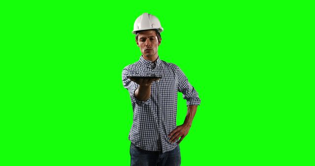 Male Engineer Holding Tablet Device on Green Screen Background - Download Free Stock Images Pikwizard.com