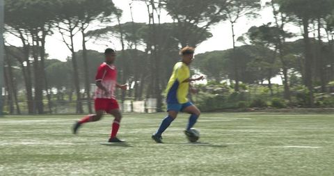 Two Soccer Players Compete Intensely During Competitive Match