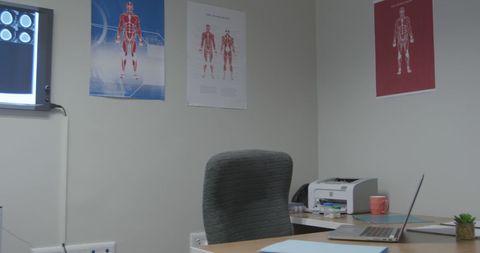 Modern doctor's office interior with medical charts and workspace