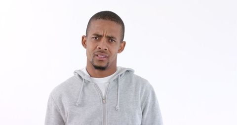 Confused African American Man in Gray Hoodie on White Background - Download Free Stock Images Pikwizard.com
