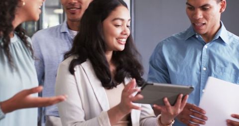 Multiracial Colleagues Collaborating in Office Environment