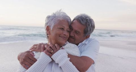 Senior Couple Embracing at Scenic Beach Sunset - Download Free Stock Images Pikwizard.com
