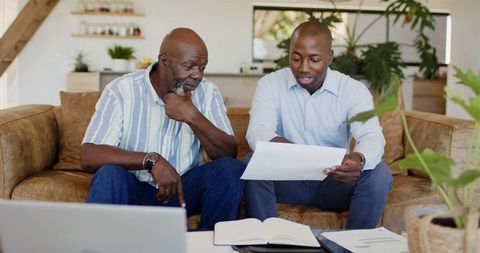 Financial advisor assisting mature client with planning