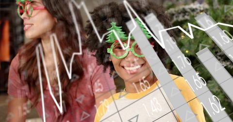 Smiling woman wearing christmas tree glasses and yellow raglan with festive data overlay