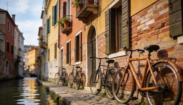 Sunlit canal bicycles leaning along brick facades on cobblestone walkway in old quarter
