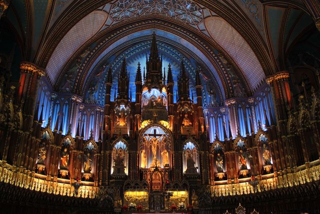 This stunning image depicts the Gothic architecture of a cathedral interior, filled with intricate carvings and vibrant stained glass. Ideal for use in travel blogs, articles on architecture, or historical documentaries, showcasing exquisite craftsmanship and sacred spaces.
