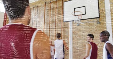 Youth Basketball Practice in Gym with Red Jersey Focus