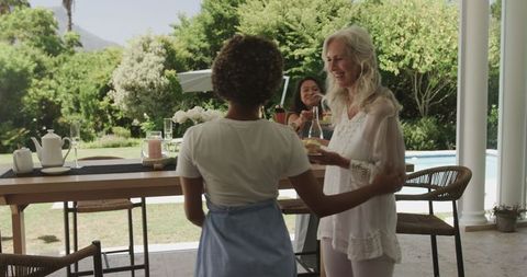 Joyful Gathering at Outdoor Wedding Reception with Refreshments