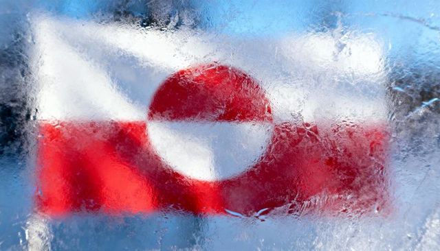 Greenland flag showing through frosted glass with ice crystals and water droplets