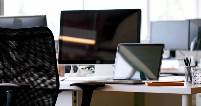 Modern Office Workspace with Desktop and Laptop Computers - Download Free Stock Images Pikwizard.com