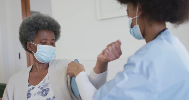 Nurse Administering Vaccine to Senior Woman in Medical Clinic - Download Free Stock Images Pikwizard.com