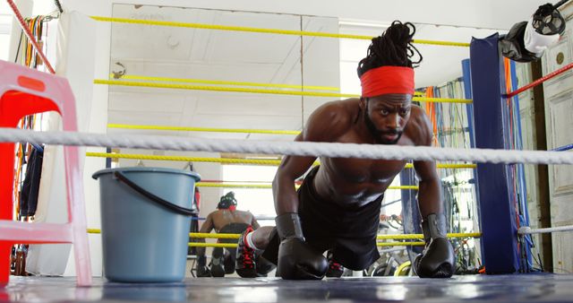 Boxer Focused on Intense Training in Gym Boxing Ring - Download Free Stock Images Pikwizard.com