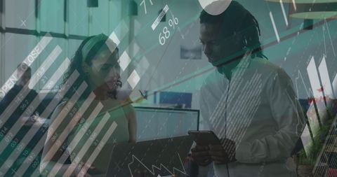 Diverse Colleagues Analyzing Digital Financial Data in Modern Workspace