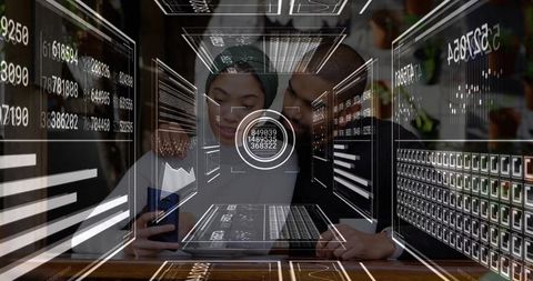 Couple collaborating using smartphone and laptop with augmented analytics overlays in cafe