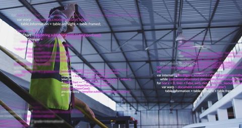 Standing warehouse worker inspecting mezzanine wearing hi-vis vest on industrial catwalk