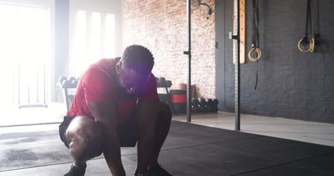 Athletic Man Preparing Exercise Workout in Gym