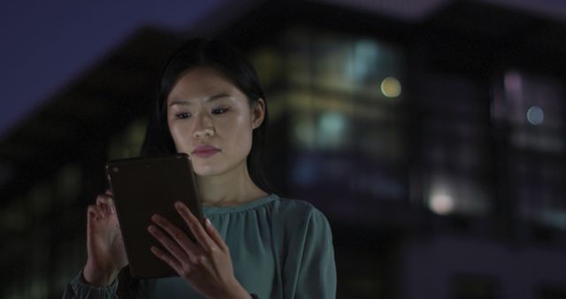 Young Professional Using Tablet at Night - Download Free Stock Images Pikwizard.com