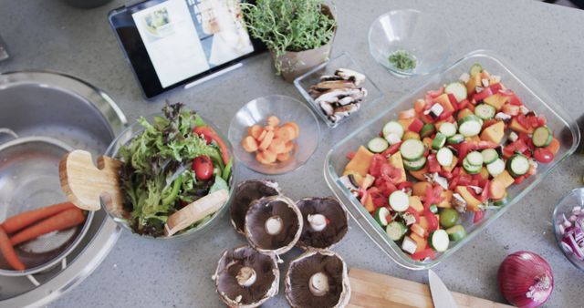 Top view of fresh vegetables and tablet in modern kitchen - Download Free Stock Images Pikwizard.com